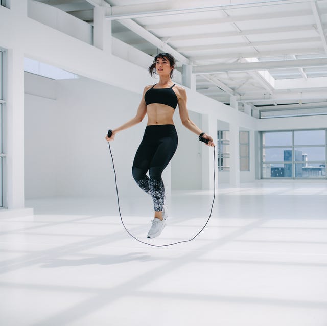 woman skipping rope in fitness studio