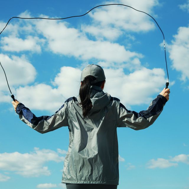 woman skipping rope outdoors