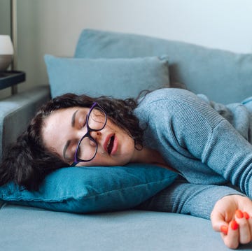 Woman sleep at home on a sofa woman sleep at home on a sofa