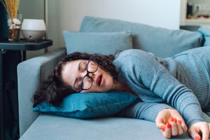 woman sleep at home on a sofa