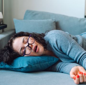 woman sleep at home on a sofa