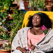 woman sleeping on yellow deck chair