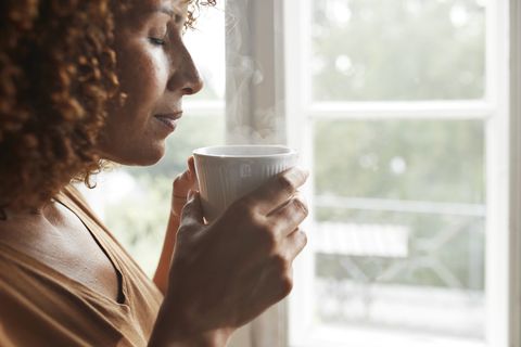 woman smelling coffee