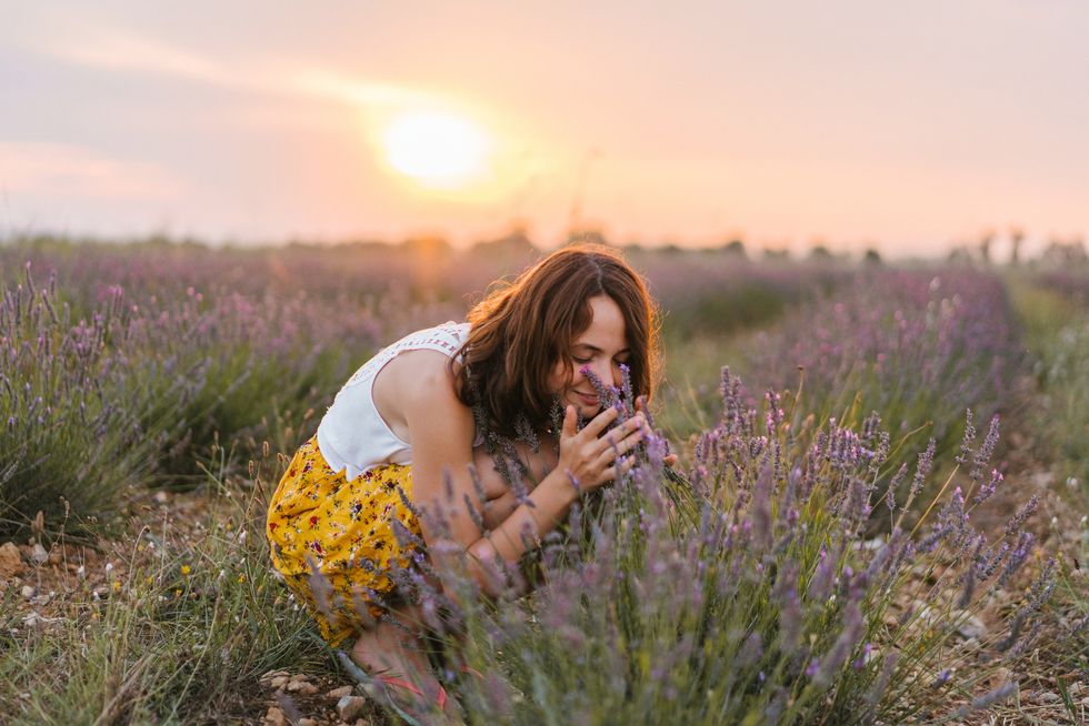 Woman smelling lavender in the field