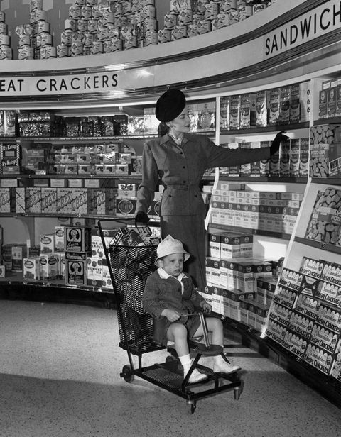 vintage photo of grocery store   woman and child shopping