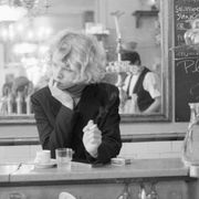 Woman Smoking at Restaurant Counter