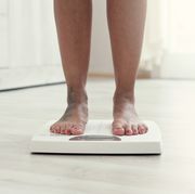 woman standing on the weight scale