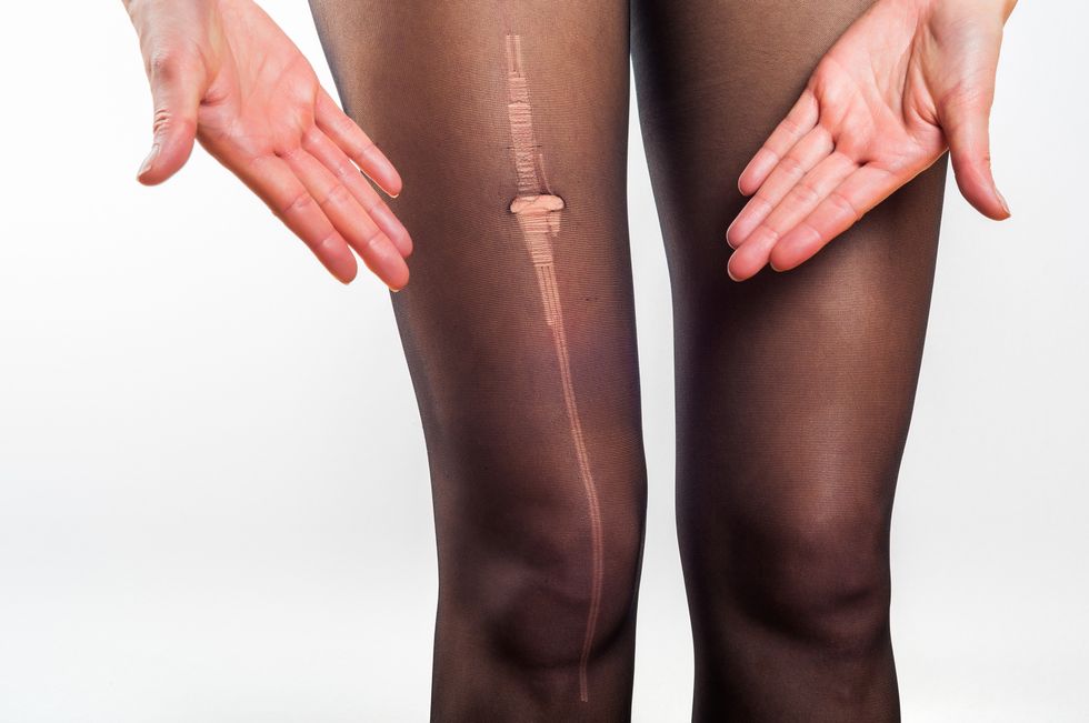 woman stressed about torn tights