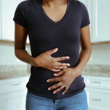 woman suffers stomach pains