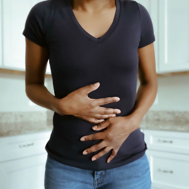 woman suffers stomach pains