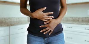woman suffers stomach pains