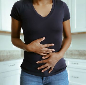 woman touching stomach