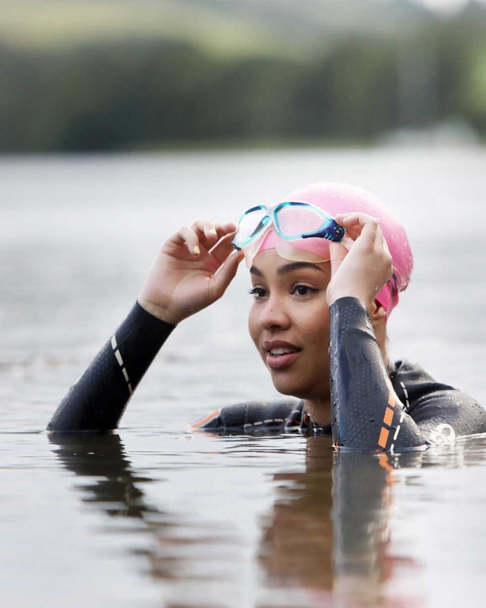 woman in cornwall,uk swimming in lake