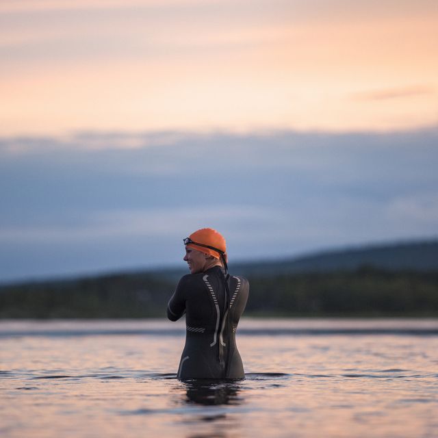 a man in a wet suit in the water