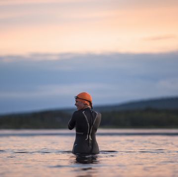a man in a wet suit in the water