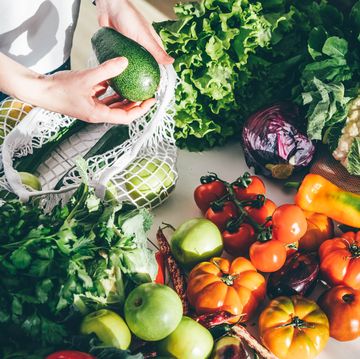 woman takes fresh organic vegetables