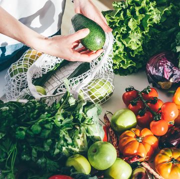 woman takes fresh organic vegetables