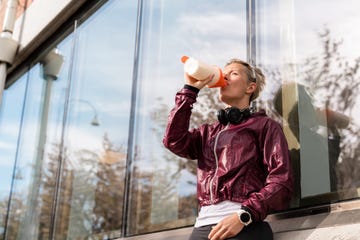 woman taking a break for a protein shake