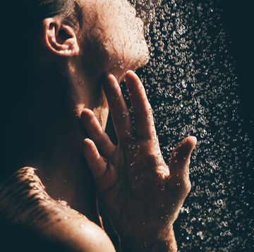 woman taking a shower close up