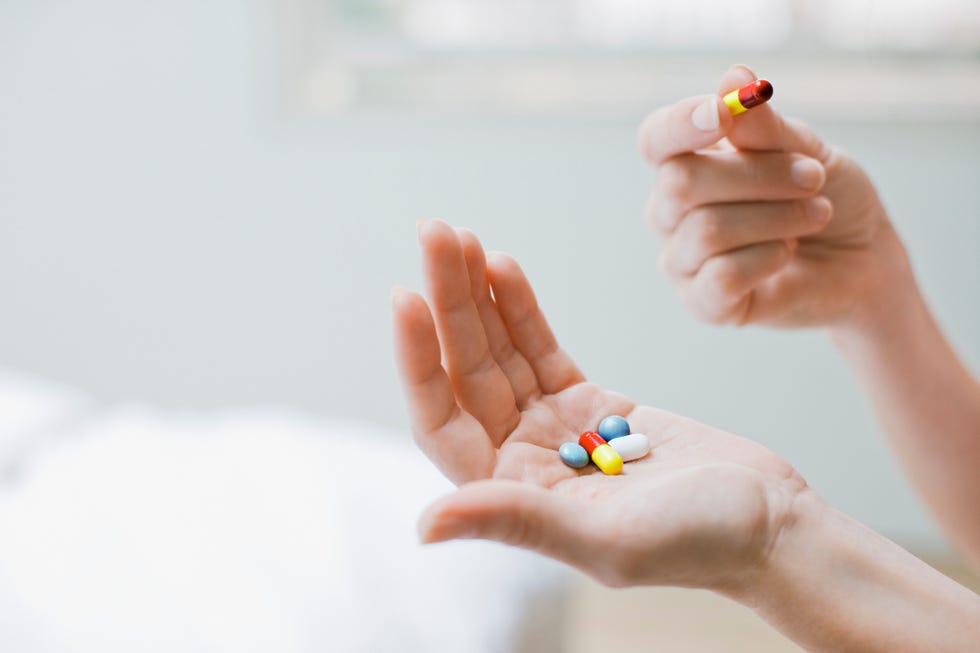 woman taking vitamins and supplements