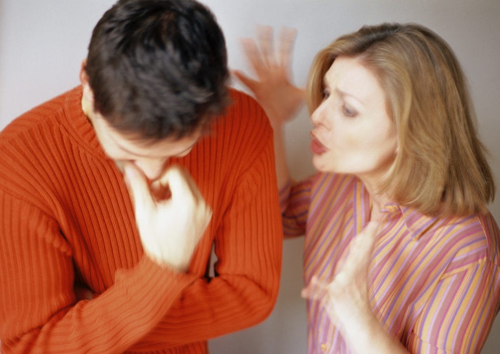 woman talking to man looking down