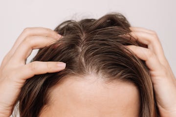 woman fingers touching scalp