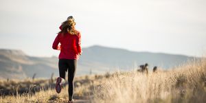 a woman trail running