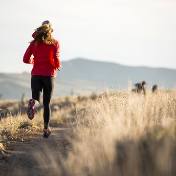 a woman trail running