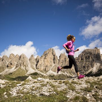 a woman trail running