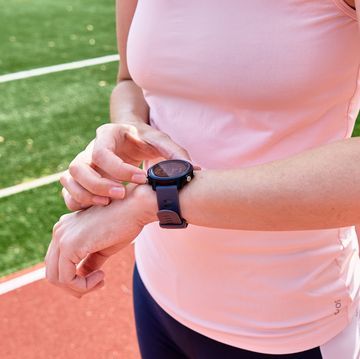 woman use fitness smart watch, checking results after sport training