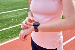 woman use fitness smart watch, checking results after sport training