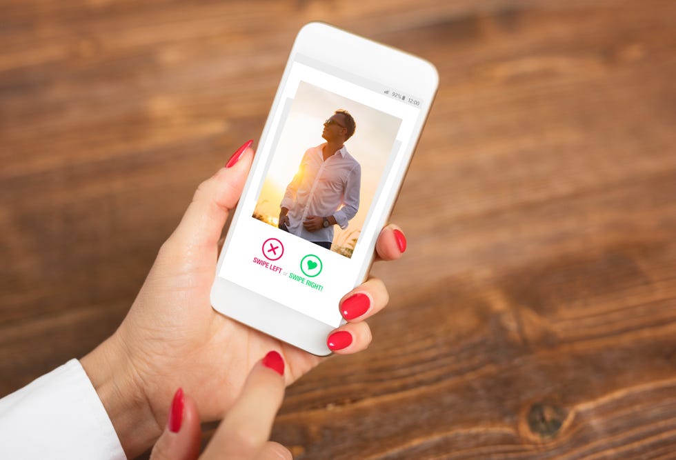 woman holding phone open to a dating app, giving up dating apps for lent