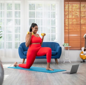 woman using exercise weights in a home