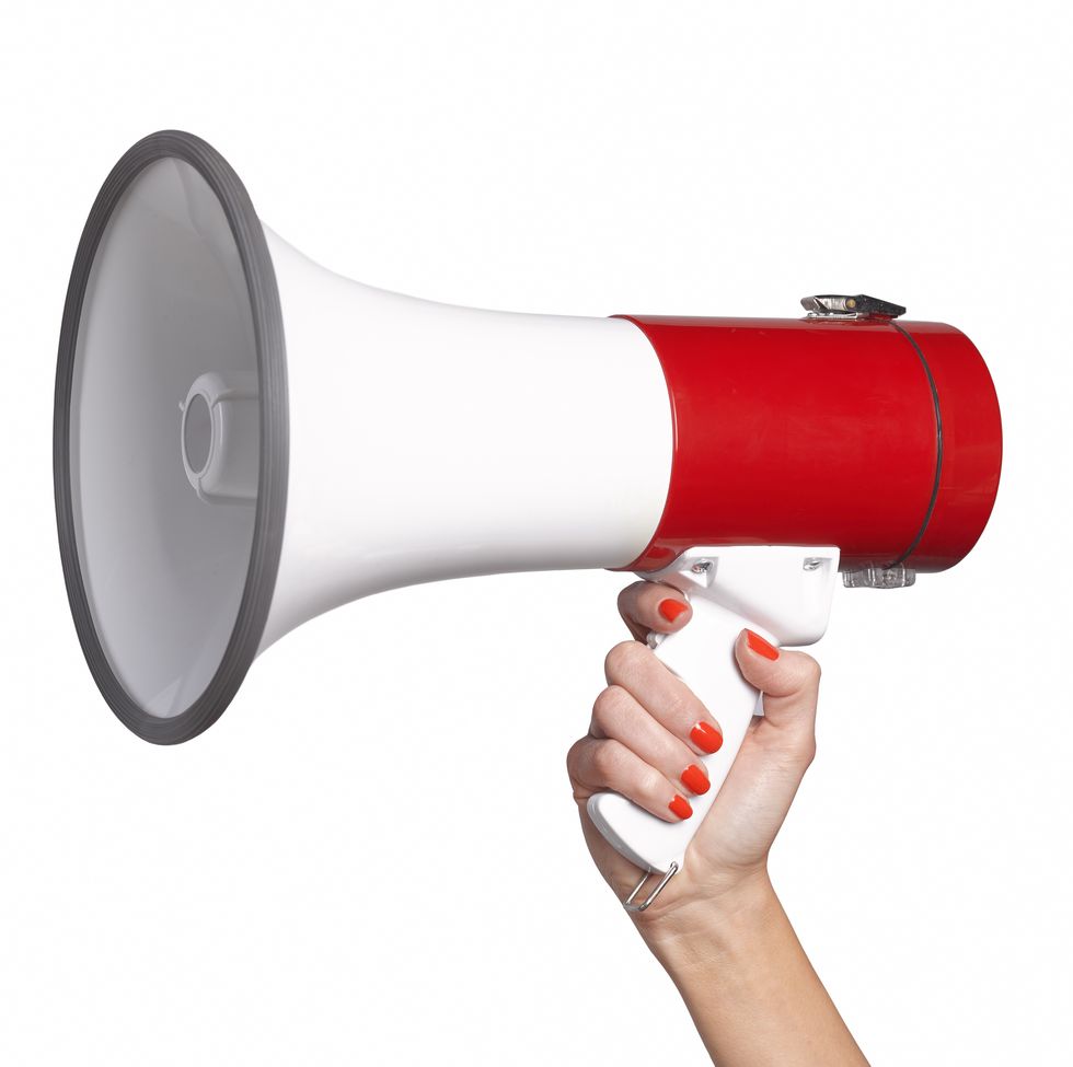 woman using megaphone with copy space