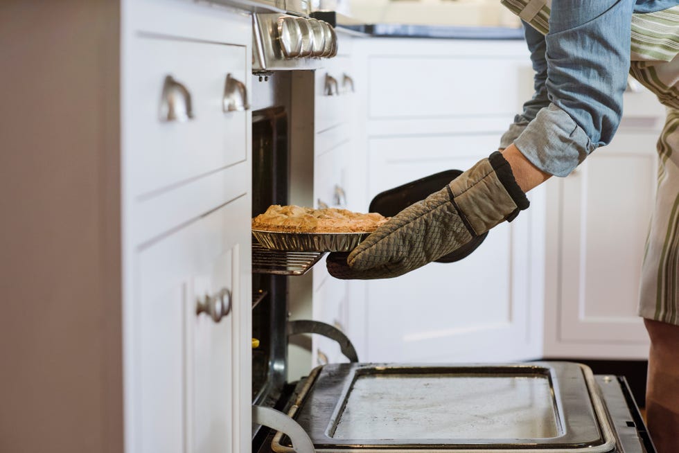 a person putting food in a pan