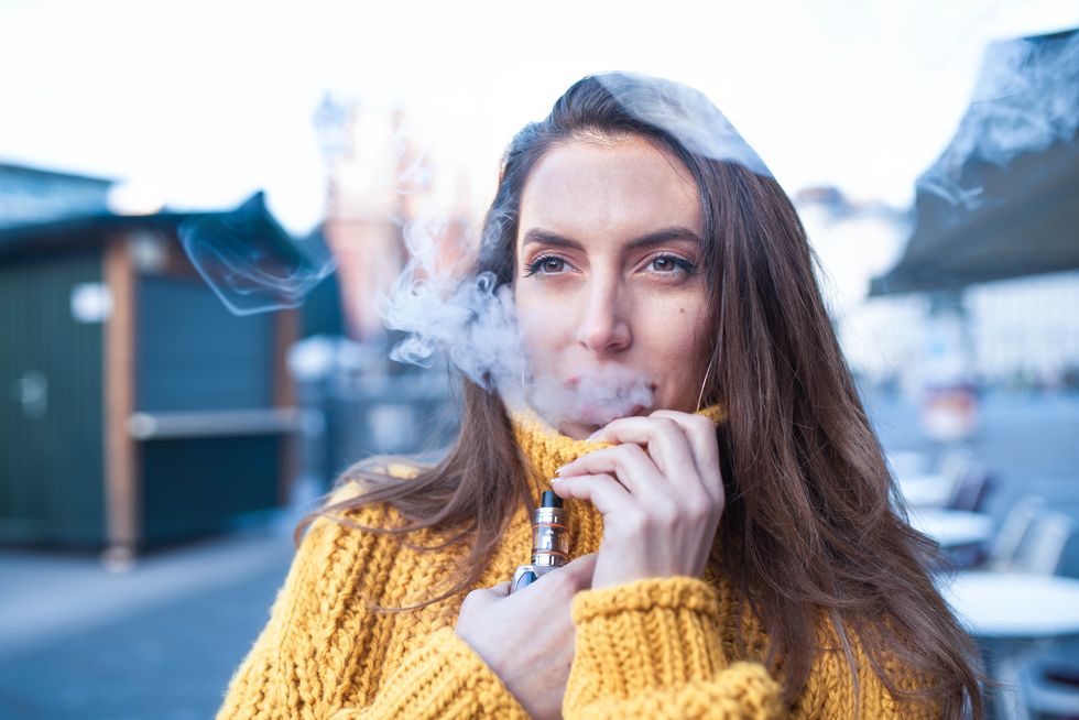 woman vaping an electronic cigarette