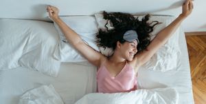 woman waking at the bright morning. sleeping mask