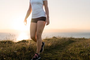 woman walking at dawn in the mountain