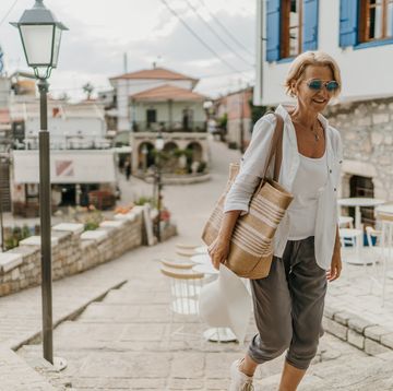 woman walking in small town