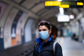 woman wearing a mask on the london subway or tube