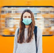 woman wearing a medical mask in a subway
