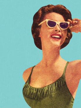 woman wearing sunglasses and green swimsuit