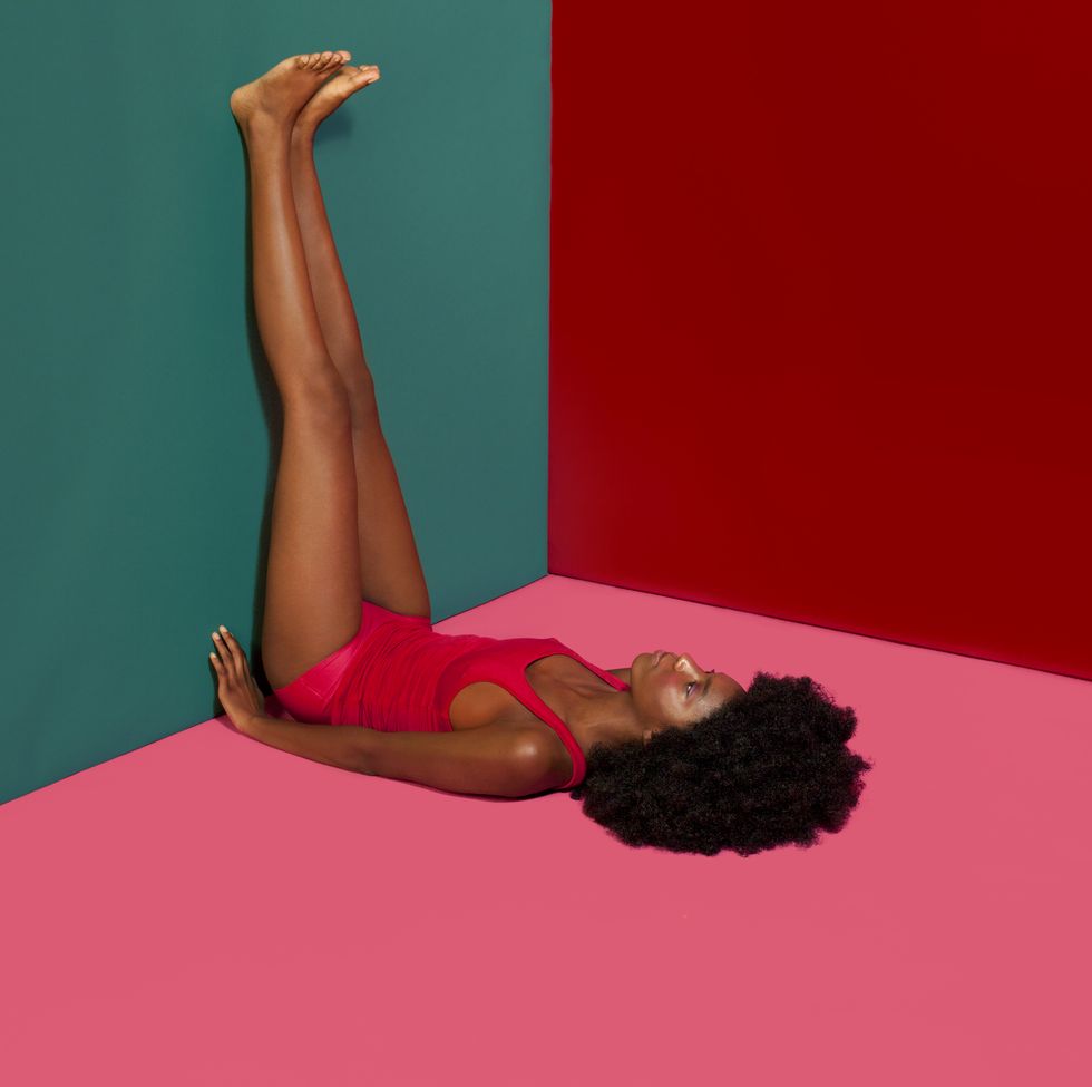 Woman with Afro in colorful room
