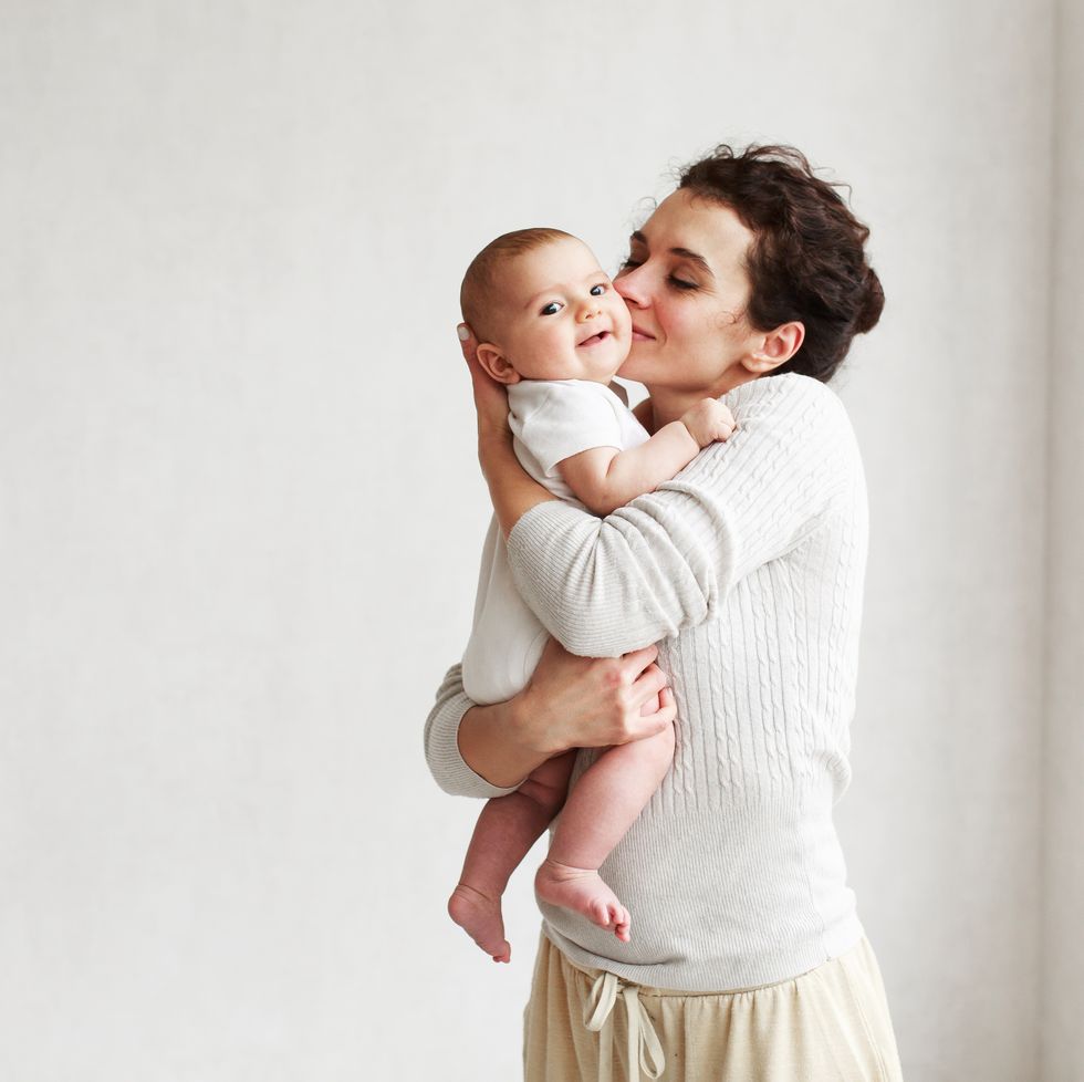 woman with baby on white background