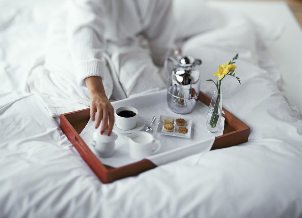 Woman with breakfast in bed