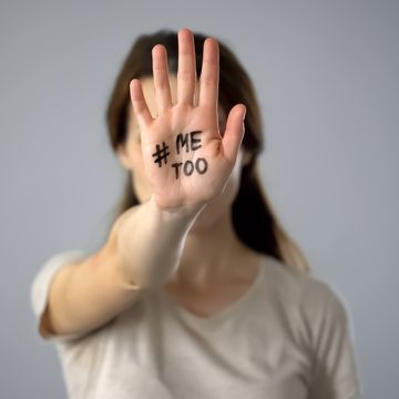 woman with me too sign on hand, movement against sexual harassment