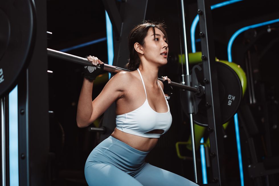woman working out bodybuilder with barbell weights at the gym bodybuilder doing exercises with barbell training sport healthy lifestyle bodybuilding, athlete builder muscles lifestyle