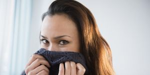 Woman wrapped in warm sweater