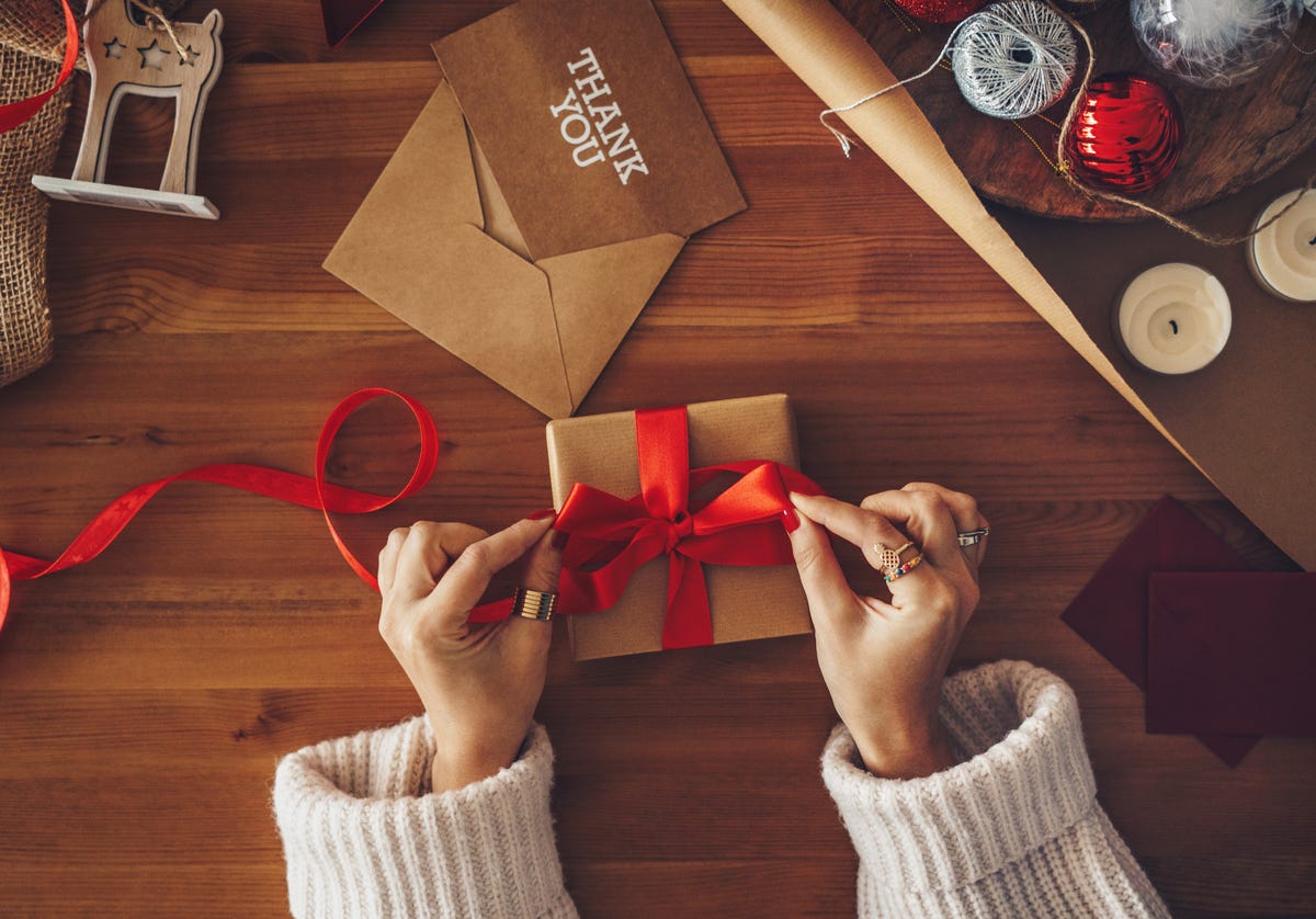 woman wrapping a christmas present