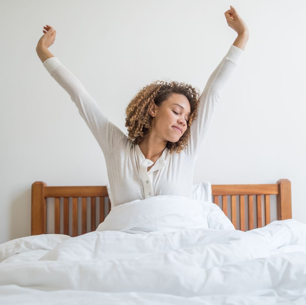 woman yawning in bed